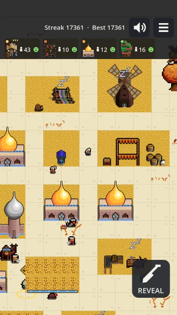 A desert village: onion-domed houses, a windmill, a market stall and golden farms on the sand